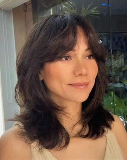 Short Butterfly Cut with Bangs